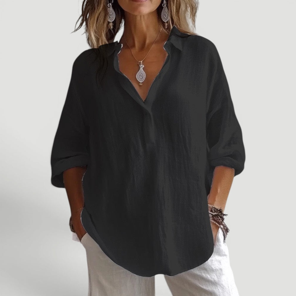 Versatile women's button-down blouse. Loose fit, modern design for a relaxed, chic everyday style.