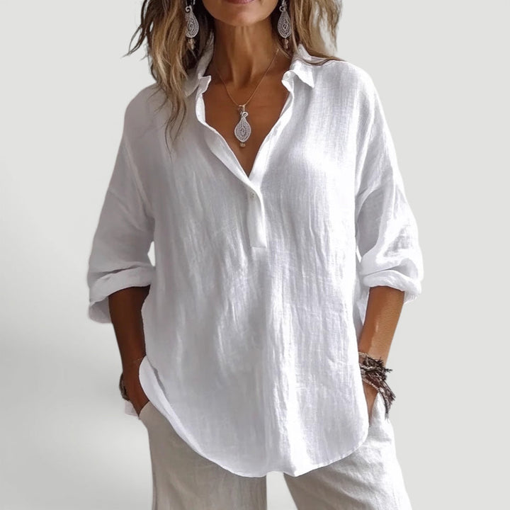 Lightweight women's chic blouse. Comfortable loose fit casual top, modern design for summer fashion.