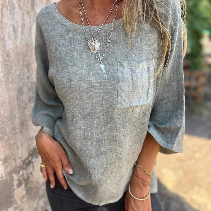 Stylish women's loose fit casual summer top with short sleeves, round neck, & chest pocket. Ideal for spring fashion.