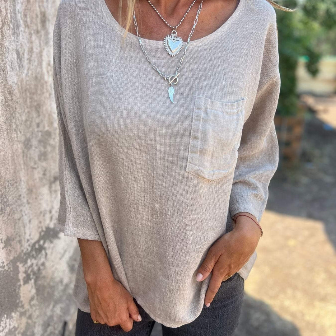 Comfortable women's loose fit short sleeve top, round neck, & chest pocket. Great for casual everyday and summer wear.