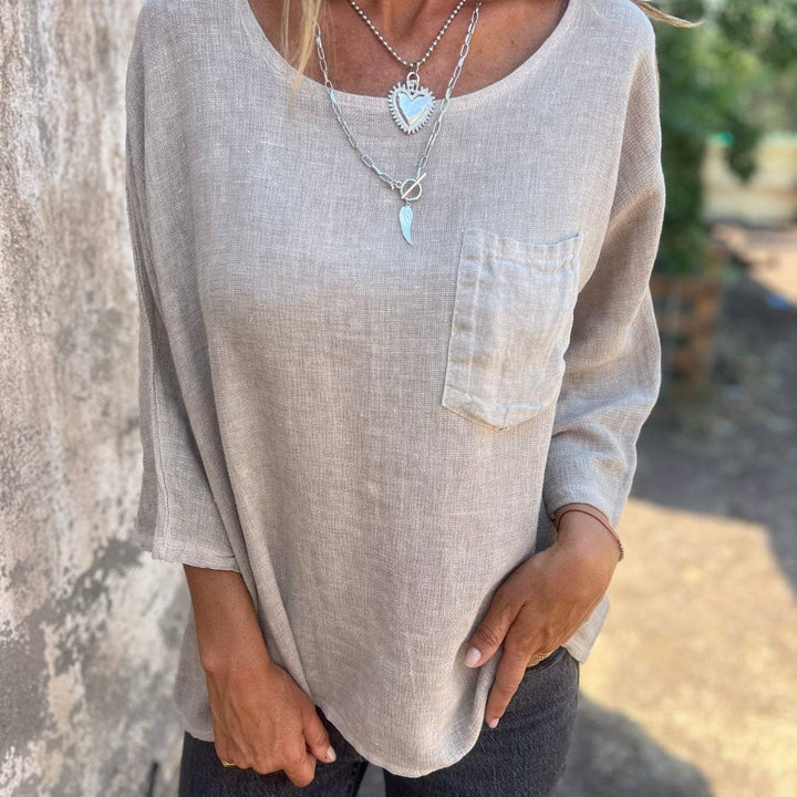 Comfortable women's loose fit short sleeve top, round neck, & chest pocket. Great for casual everyday and summer wear.