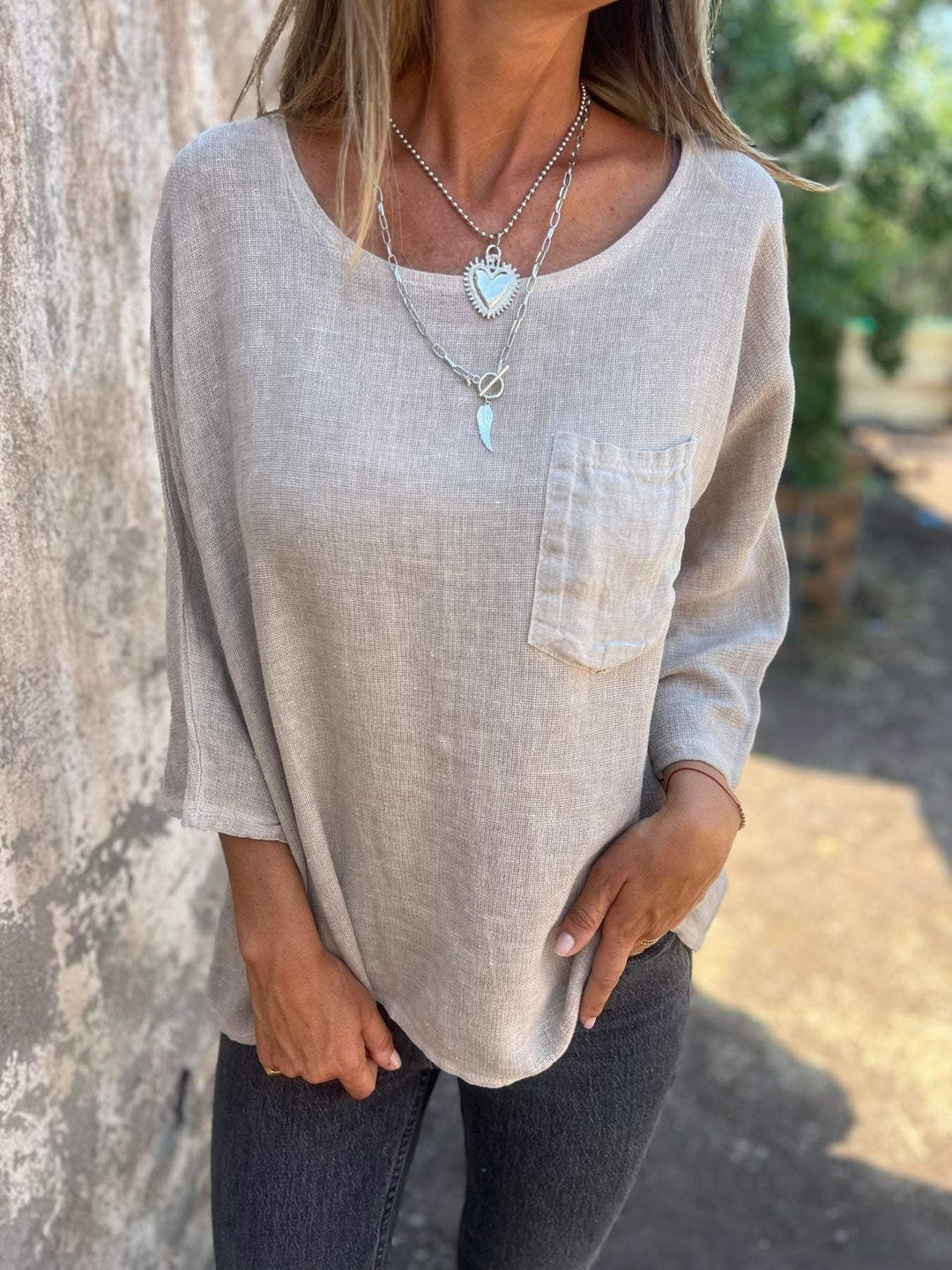 Breezy women's loose fit summer top, short sleeve, round neck, & chest pocket. Comfortable casual top for spring.