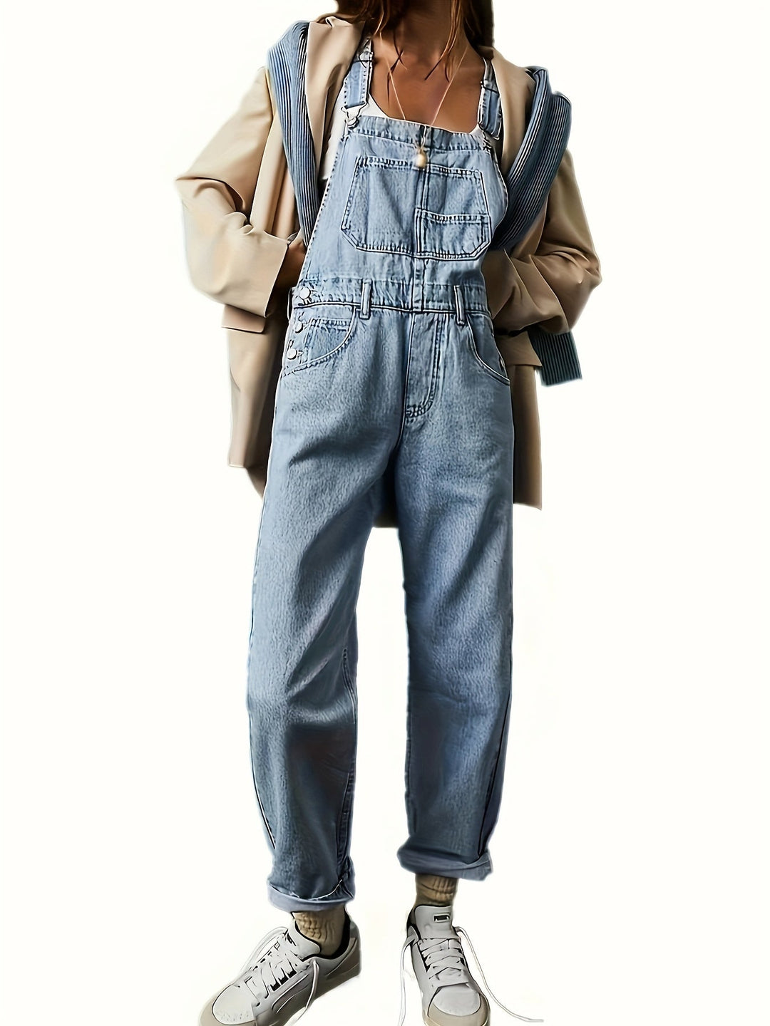 Women's loose fit denim dungarees in classic blue. Casual ladies overall with adjustable straps for comfort.