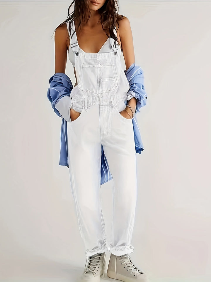Black women's denim overall, loose fit for everyday style. Comfortable ladies dungarees with adjustable straps.