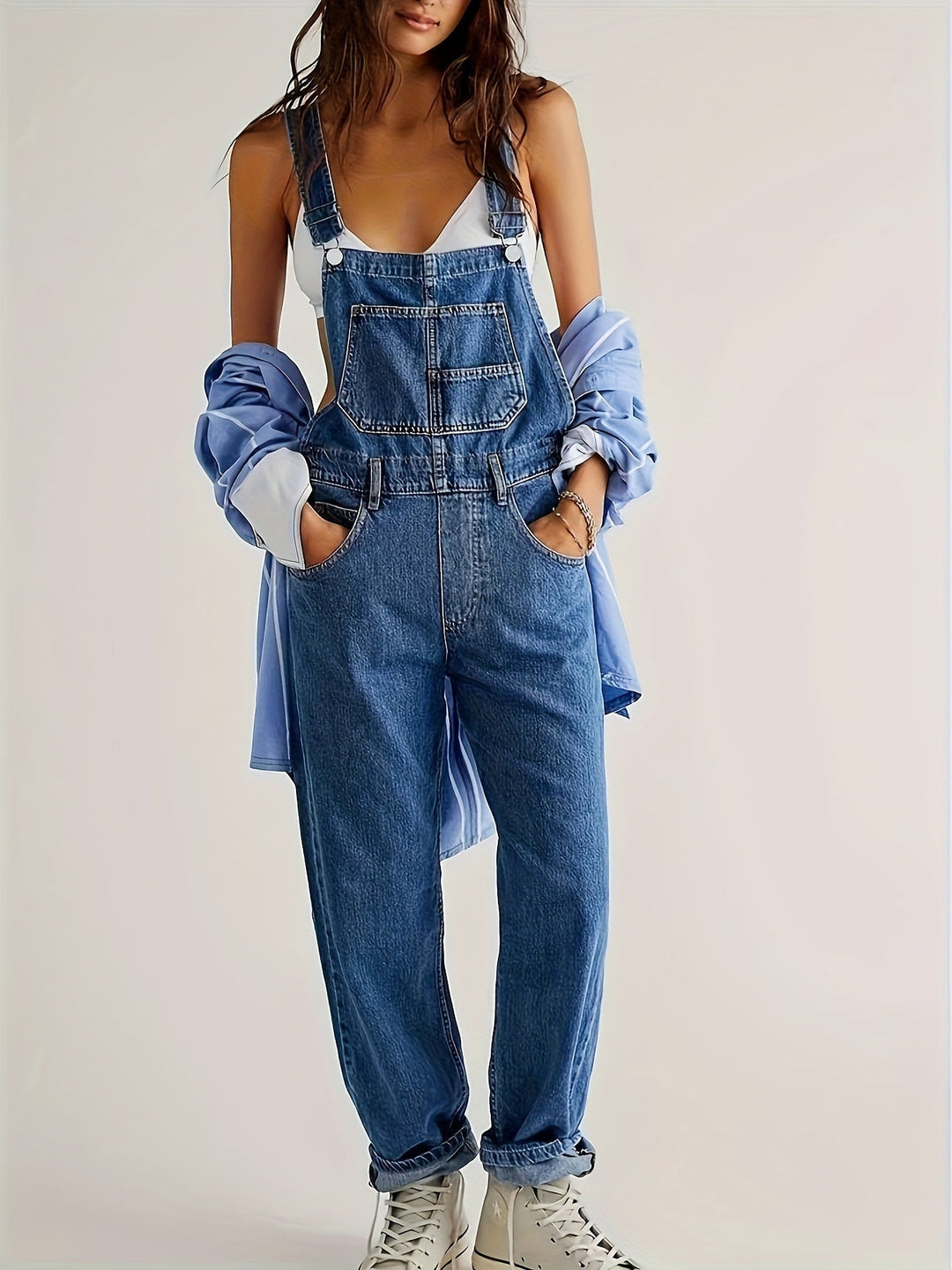 Navy blue women's denim dungarees, loose fit for casual fashion. Ladies overall with comfort wear design.