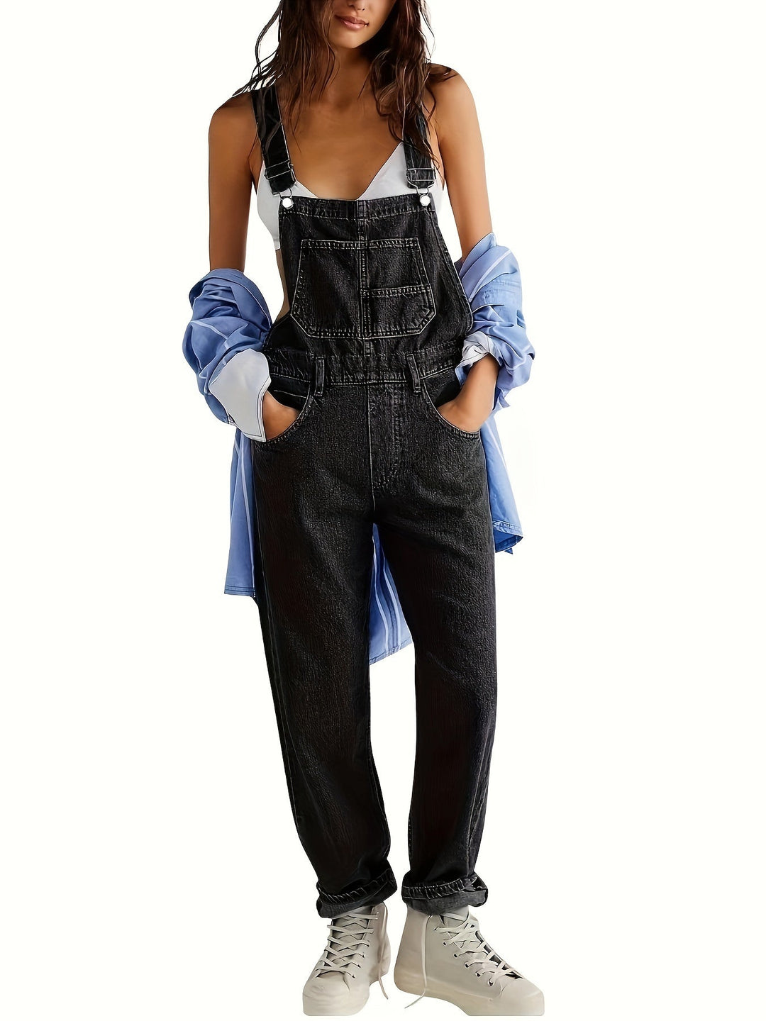 Light blue women's loose fit denim overall. Casual ladies dungarees with adjustable straps for comfort.