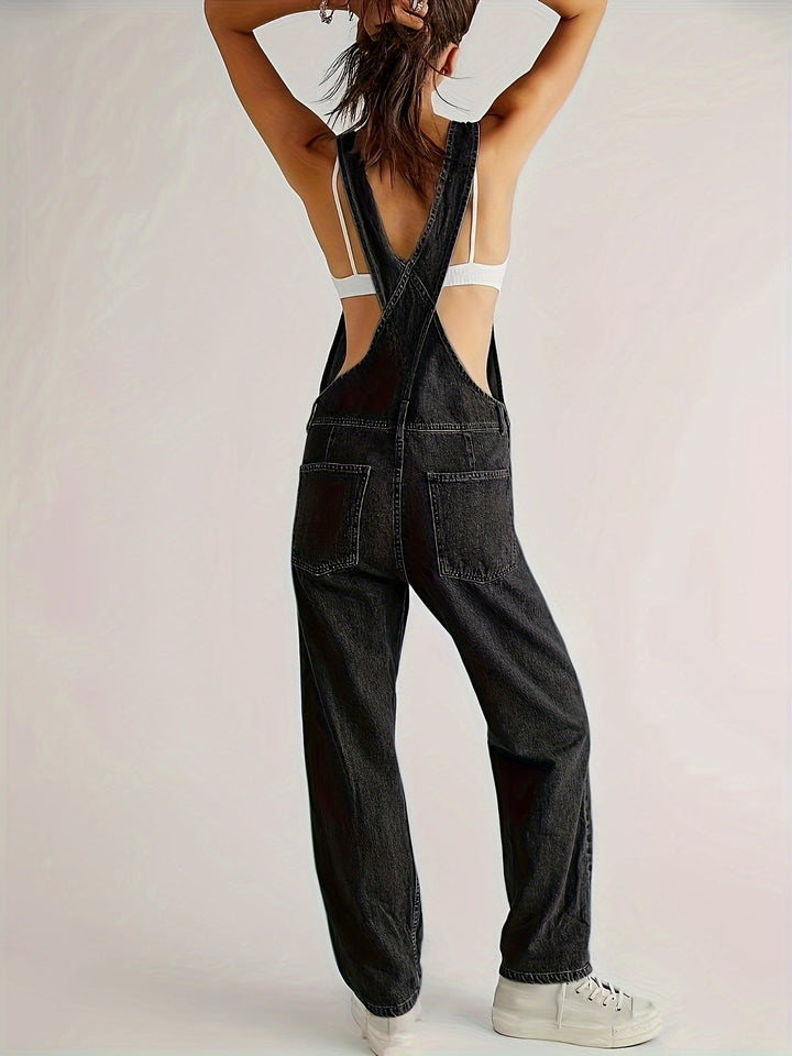 Ladies denim dungarees, loose fit in navy blue. Casual overall with adjustable straps, ideal for comfort.