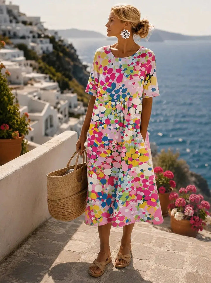 Women's loose fit floral print midi summer dress with short sleeves & pockets, ideal for casual wear or holidays.