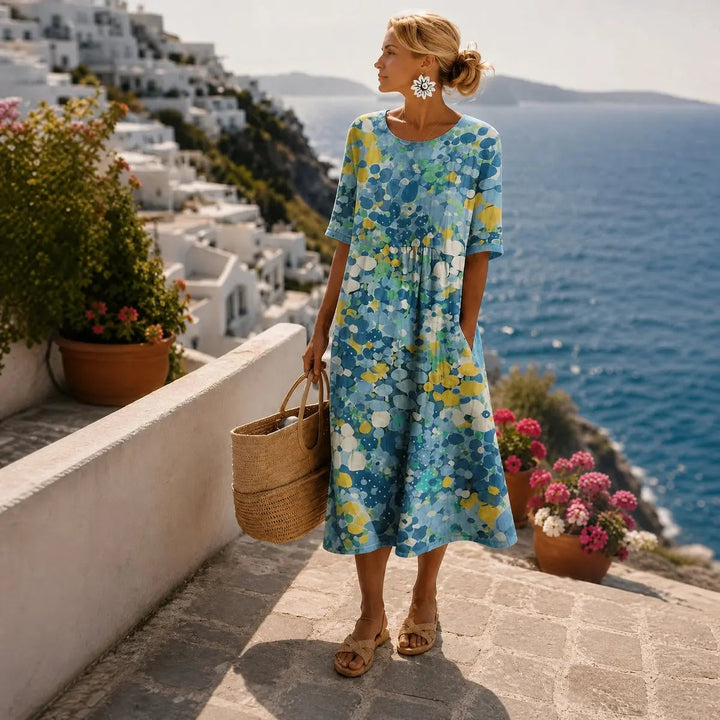 Elegant women's floral print midi summer dress. Loose fit, short sleeve, pockets, great for casual days & holidays.