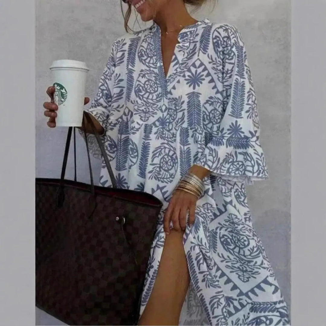 Comfortable loose fit women's floral print summer tunic dress with a stylish tiered hem.