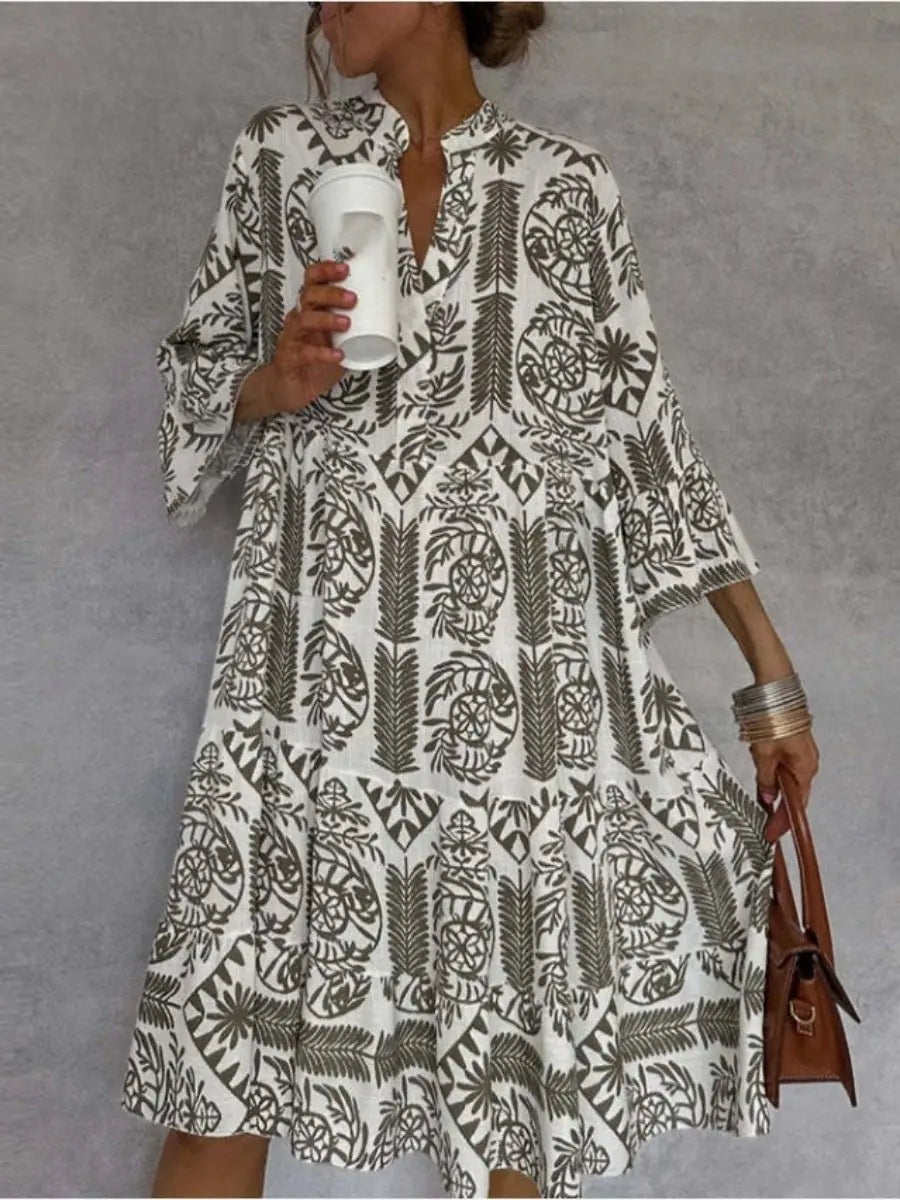 Model wearing a flowy floral print loose fit women's tunic dress for a relaxed summer look.