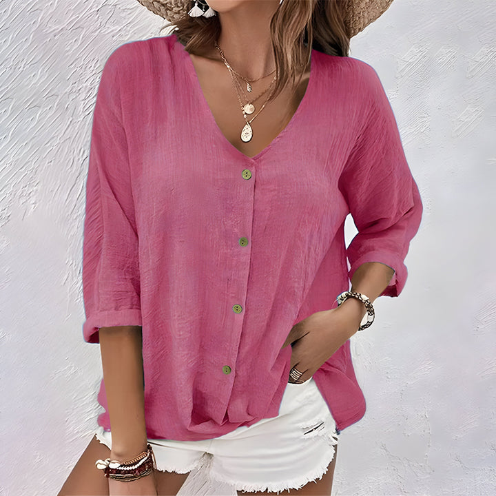 Versatile V-neck women's long sleeve blouse, loose fit & button-front design. A stylish casual top for autumn fashion.