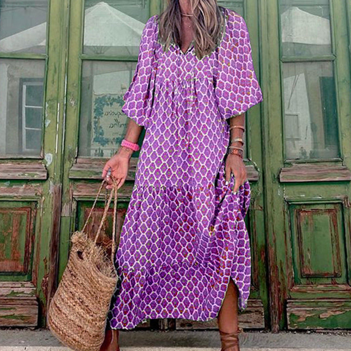 Women's loose fit printed ruffled midi dress in motion, showcasing comfortable drape & vibrant print.
