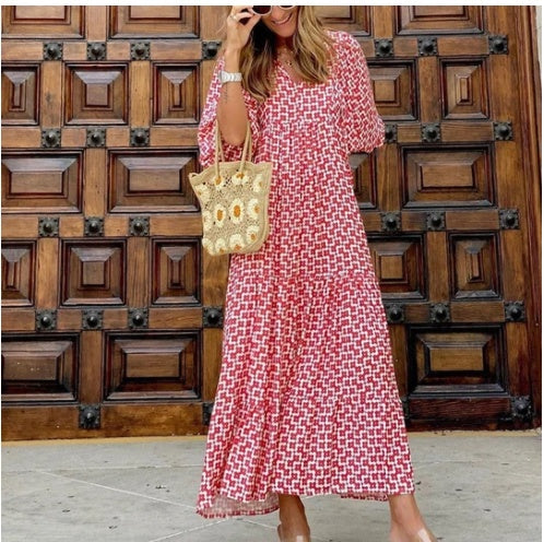 Stylish women's autumn dress with three-quarter sleeves, loose fit, vibrant print, & ruffles.