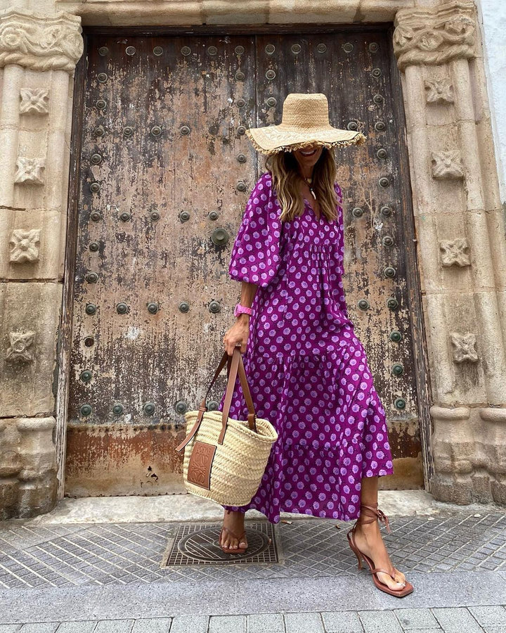 Close-up of women's printed loose fit dress, highlighting delicate ruffles & vibrant pattern.