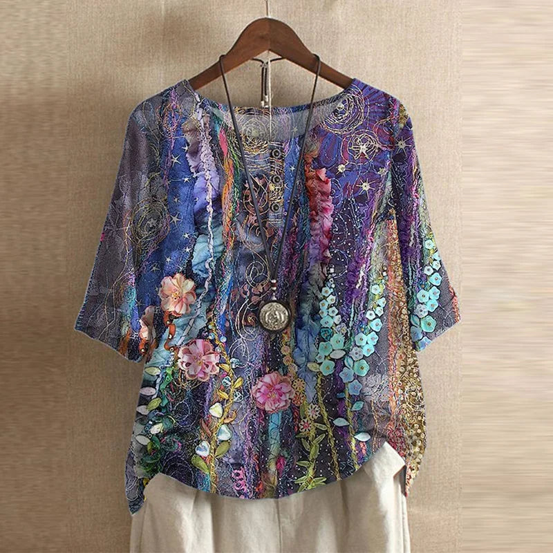 Women's printed tunic blouse paired with shorts, illustrating a complete summer casual outfit.