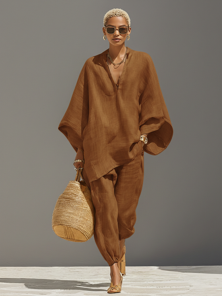 Stylish women's oversized set with a notched neckline top & tapered pants, perfect for leisure.