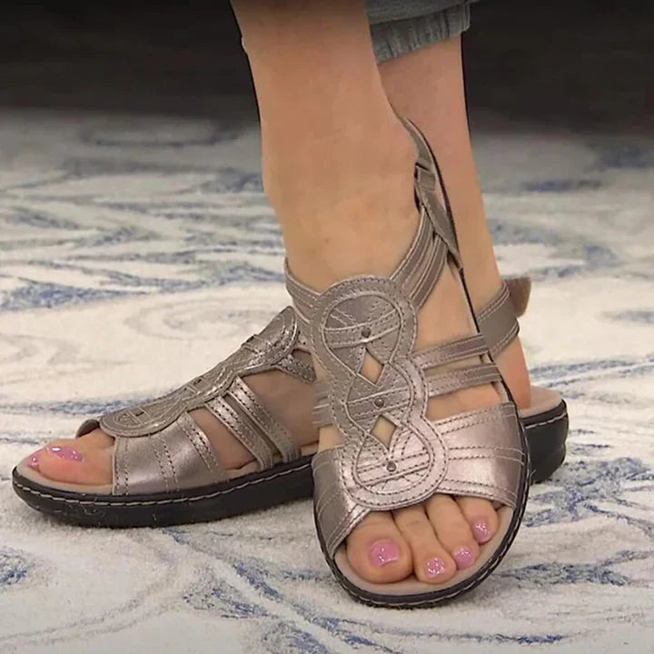 Casual women's Lotus flat sandals with a comfortable multi-strap design. Open-toe summer footwear for everyday ease.