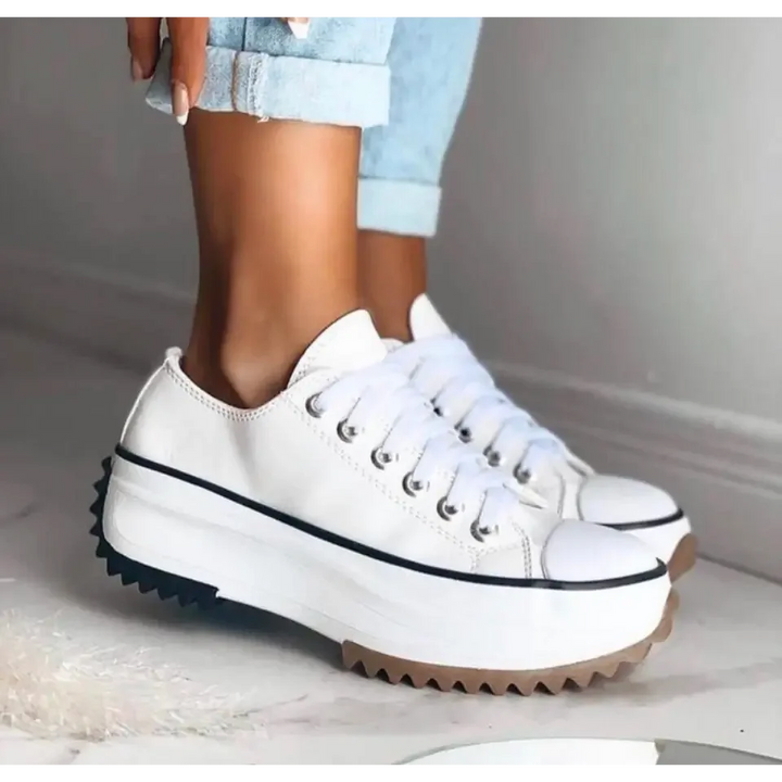 Fashionable women's low-top platform sneakers with a chunky sole, offering supportive & comfortable wear.