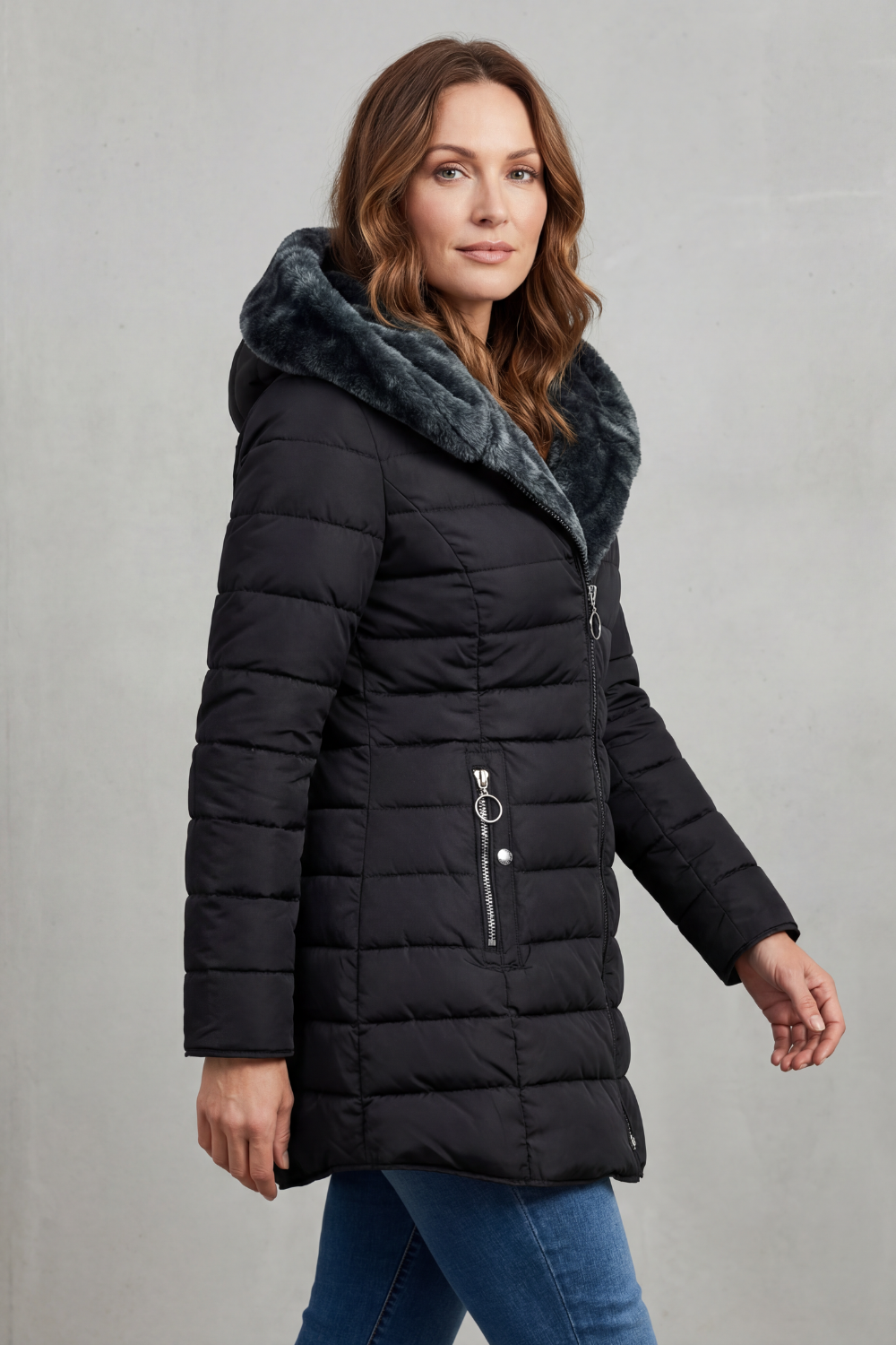 Stylish women's long winter parka coat, insulated for warmth, essential cold weather fashion outerwear.