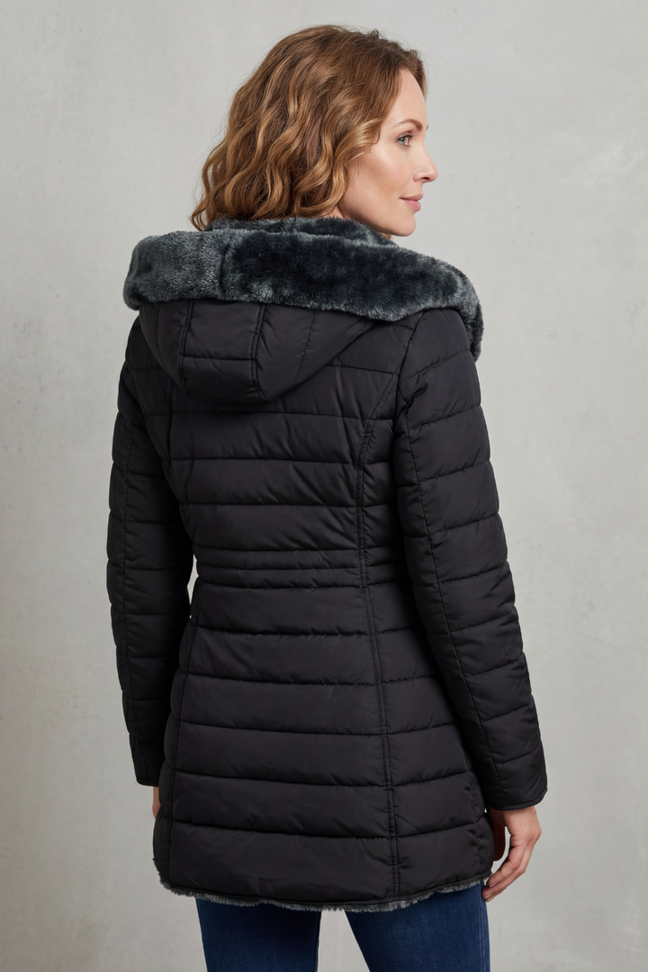 Durable women's winter parka jacket, insulated & warm, essential long outerwear for cold climates.