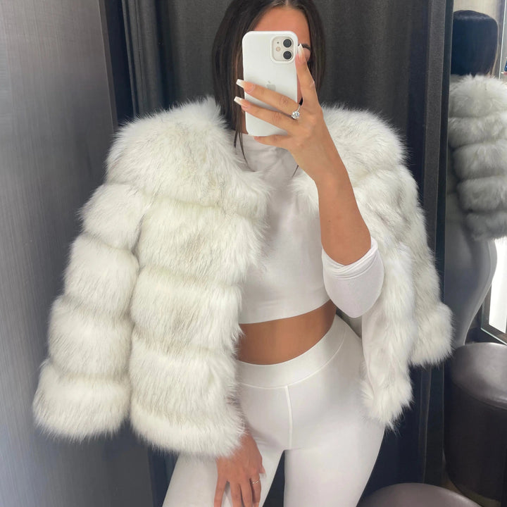 Designer women's padded winter coat. Elegant warmth, cozy comfort for stylish cold-weather outerwear.