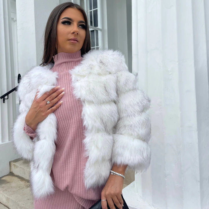 Essential women's warm padded winter jacket. A chic, luxurious coat for elegant cold-weather fashion.