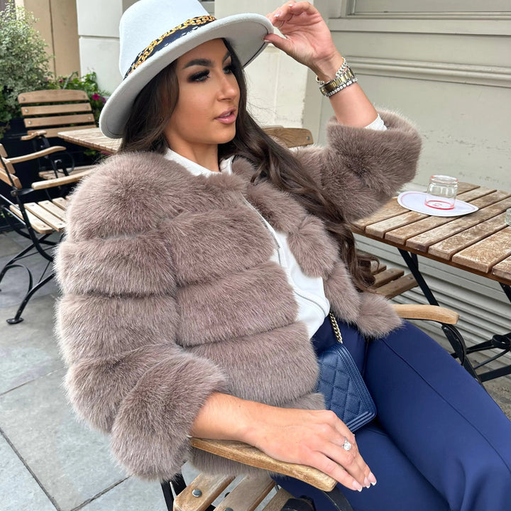 Cozy & warm women's padded jacket. Luxurious outerwear for chic winter style and comfort.