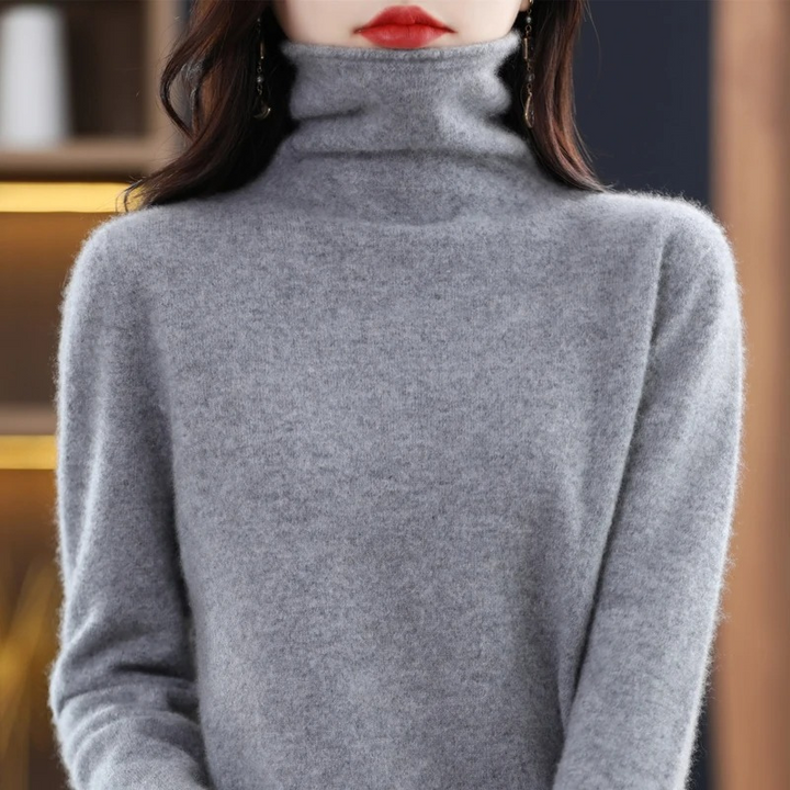 Premium women's pullover featuring a sophisticated roll neck