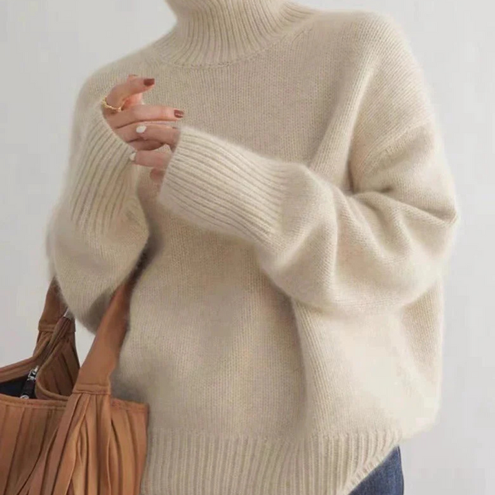 Model wearing the Amelia long sleeve turtleneck sweater, perfect for winter fashion.
