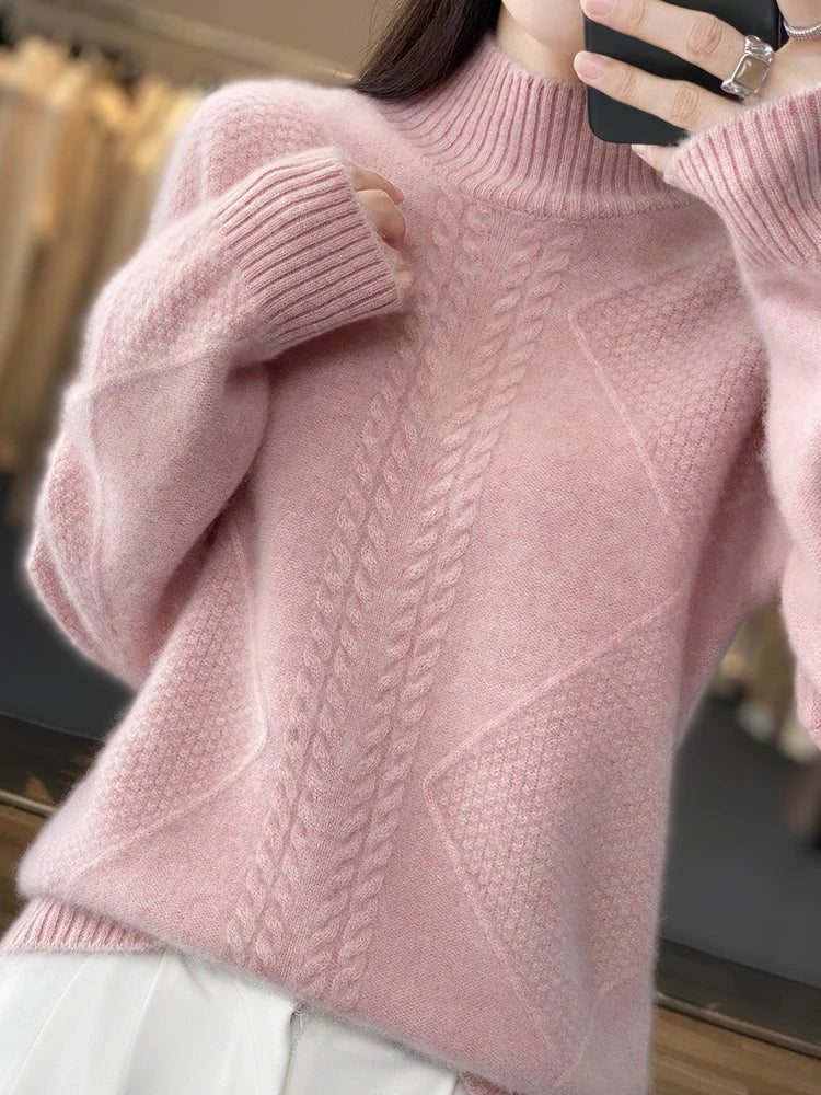 Close-up of the intricate cable knit pattern on a women's soft cashmere sweater.