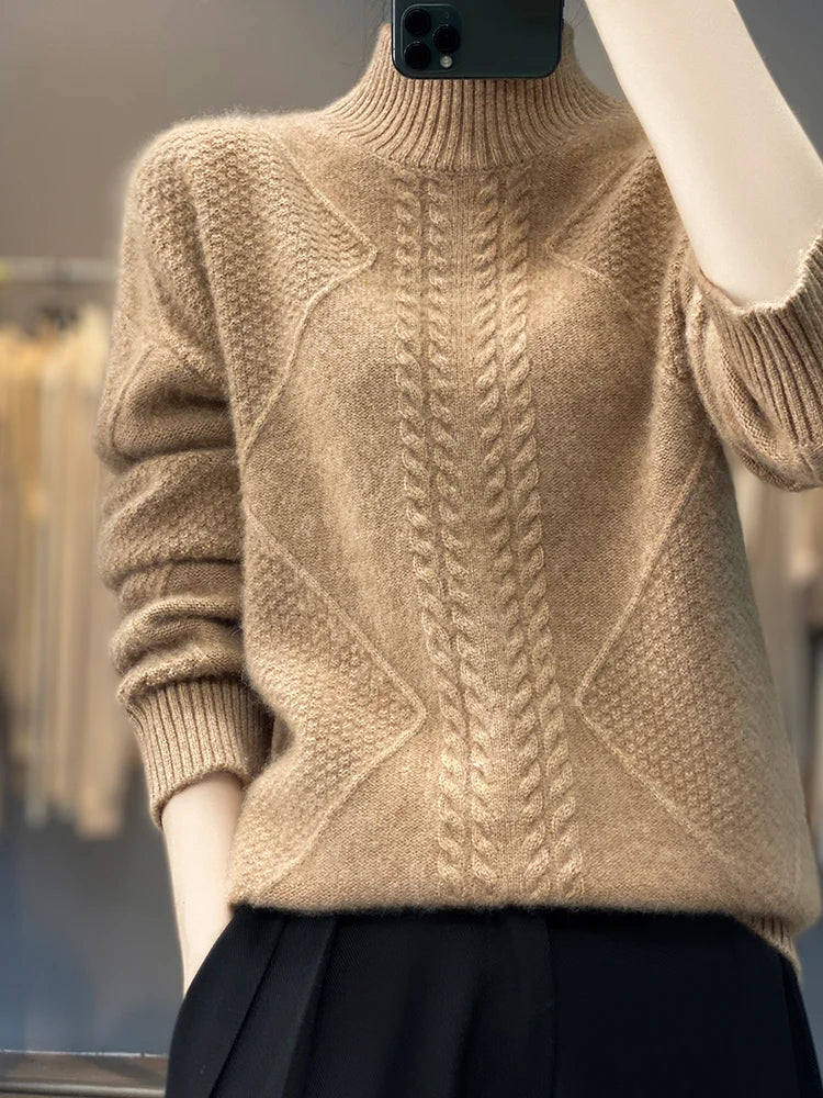 Front view of a women's cable knit cashmere jumper, highlighting the roll neck.
