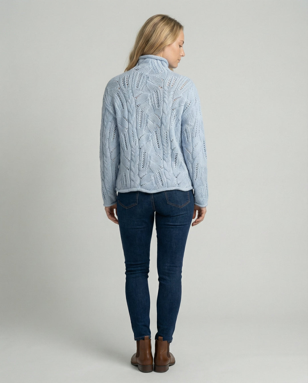 Minimalist women's blue cashmere sweater, luxurious feel, essential cozy knit