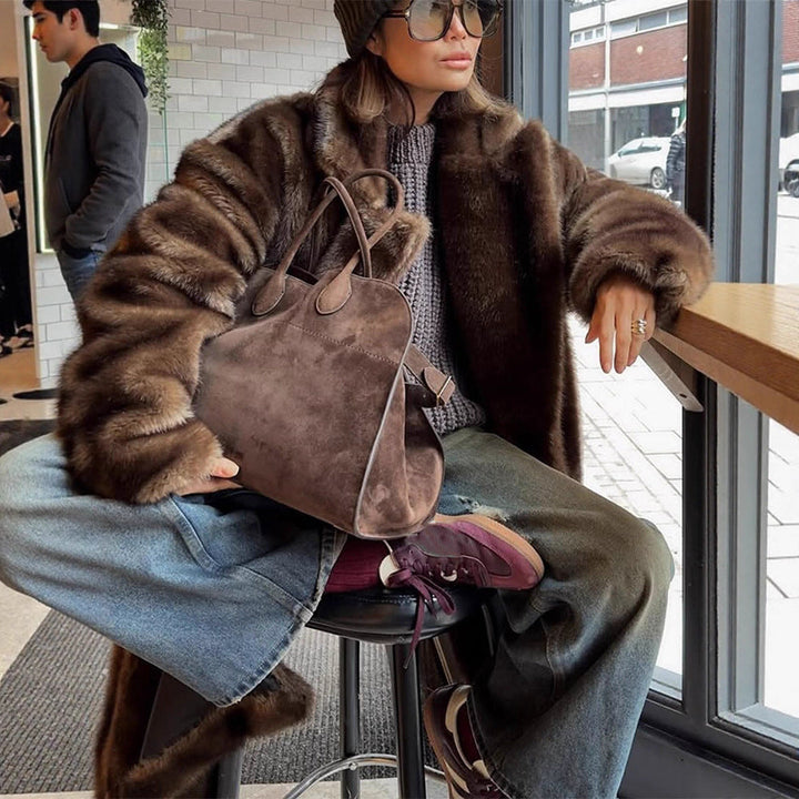 Chic women's winter fashion: elegant brown faux fur jacket
