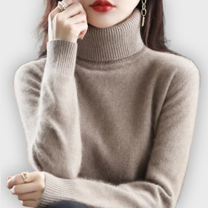 Women's luxury cashmere turtleneck sweater in classic black, a cozy winter essential.