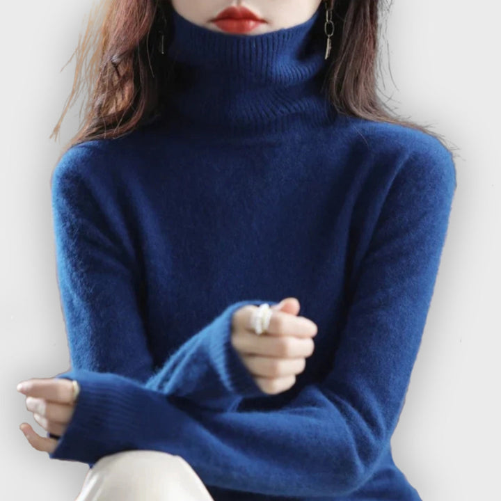 Shop Olivia Ashford's women's cashmere turtleneck sweater for luxurious warmth.