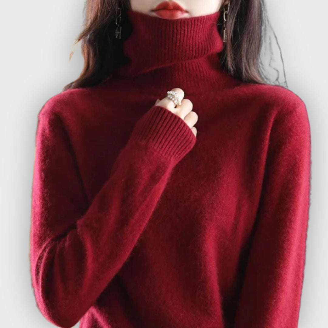 Close-up of soft cashmere knit on a women's elegant turtleneck sweater by Olivia Ashford.
