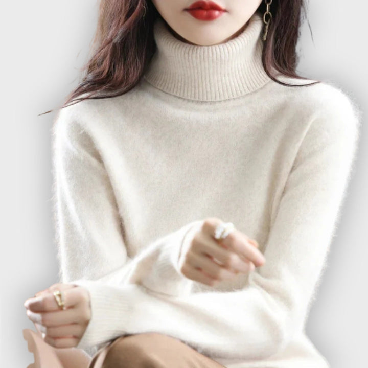 Model wearing a versatile women's cashmere turtleneck sweater, perfect for layering.