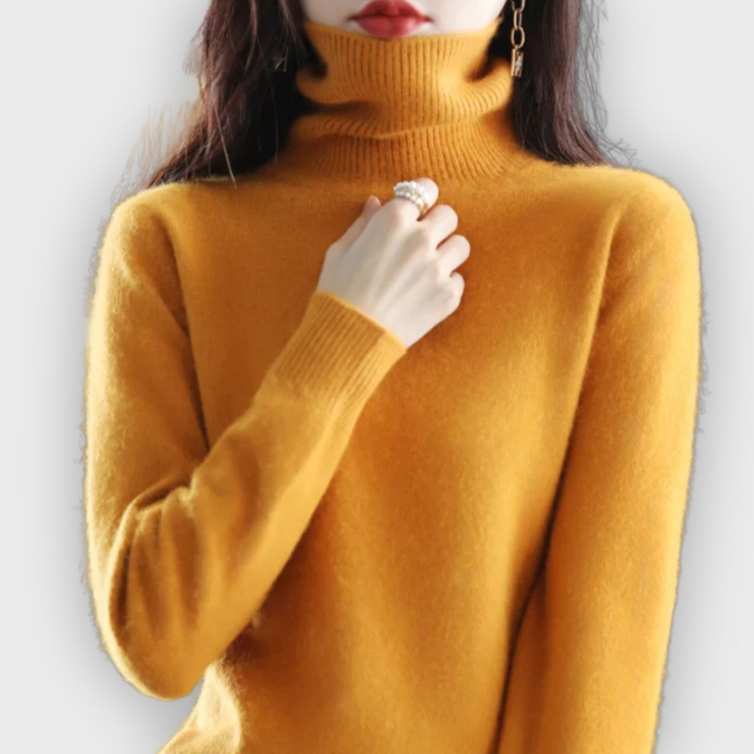 Olivia Ashford women's cashmere turtleneck sweater, highlighting premium craftsmanship.