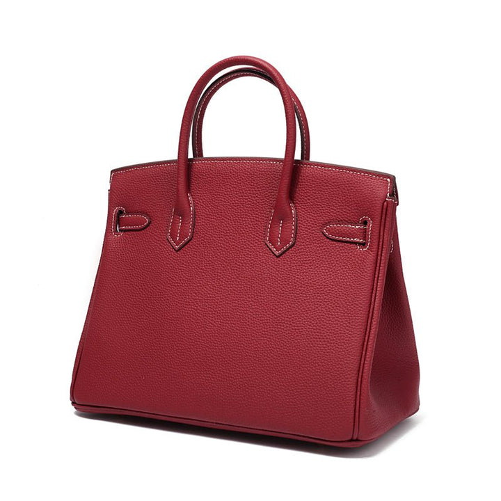 Luxury cognac leather purse with stylish gold hardware