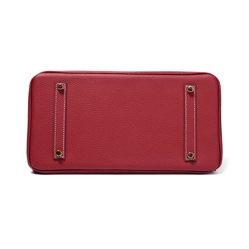 Women's designer bag, cognac leather, gold accents, elegant