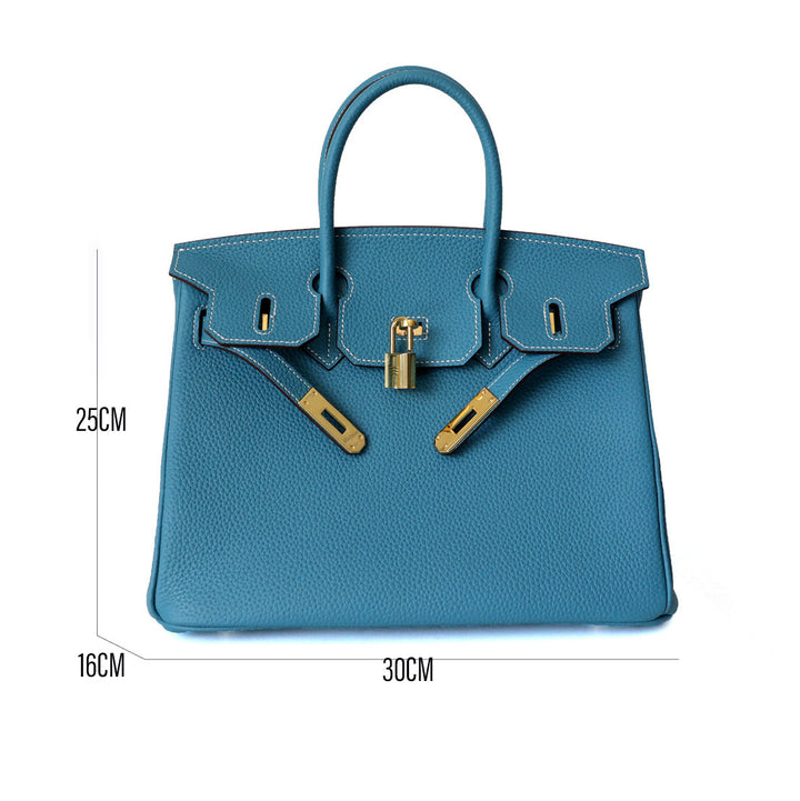Genuine leather handbag, cognac, featuring elegant gold hardware