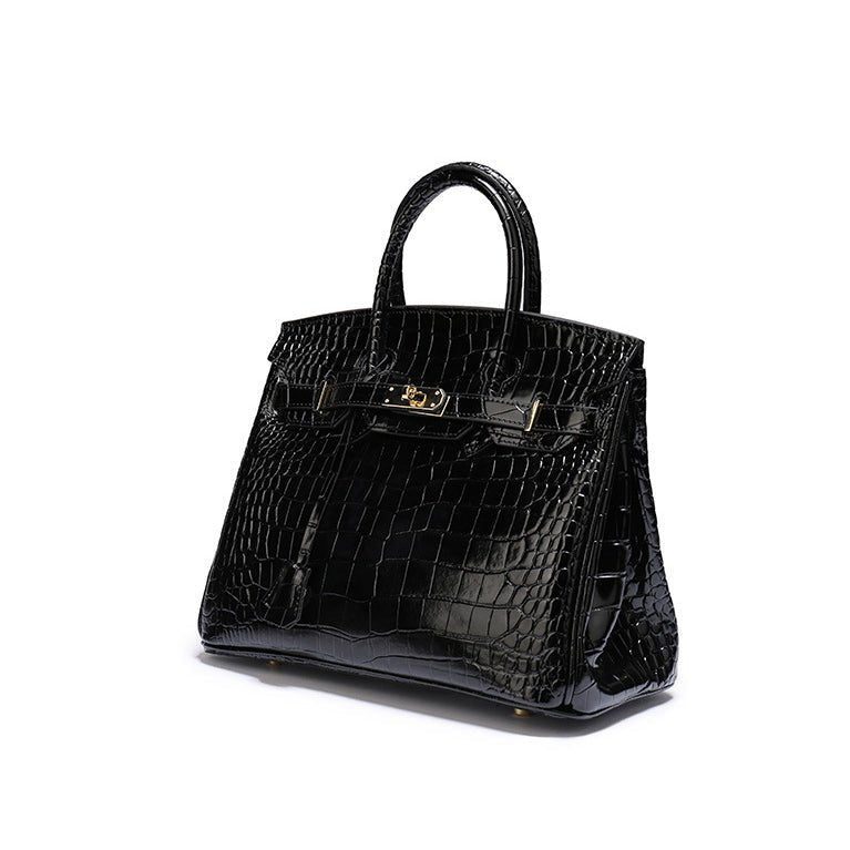 Sophisticated cognac top handle bag with polished gold hardware