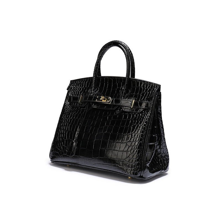 Sophisticated cognac top handle bag with polished gold hardware