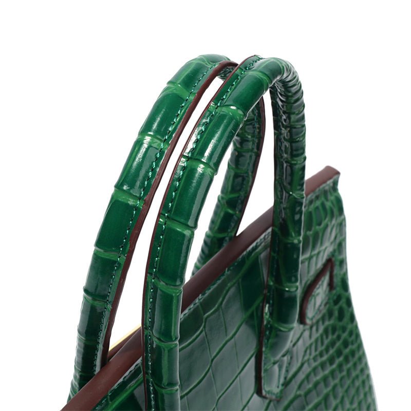 Stylish cognac colored leather purse with golden embellishments