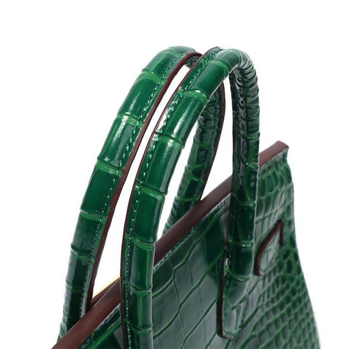 Stylish cognac colored leather purse with golden embellishments