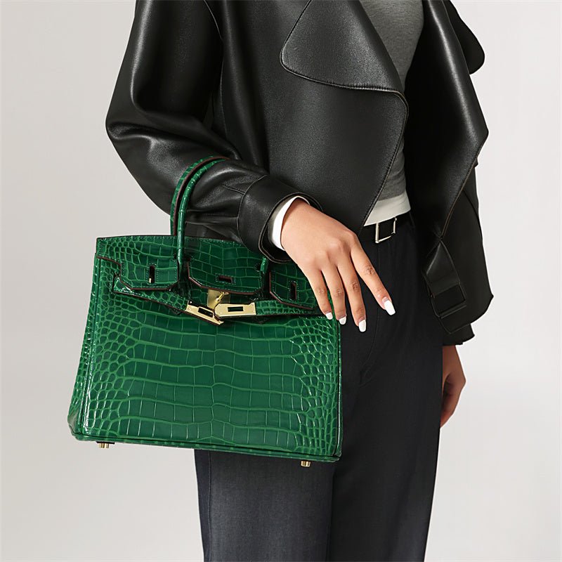 Elegant genuine leather handbag with classic gold accents