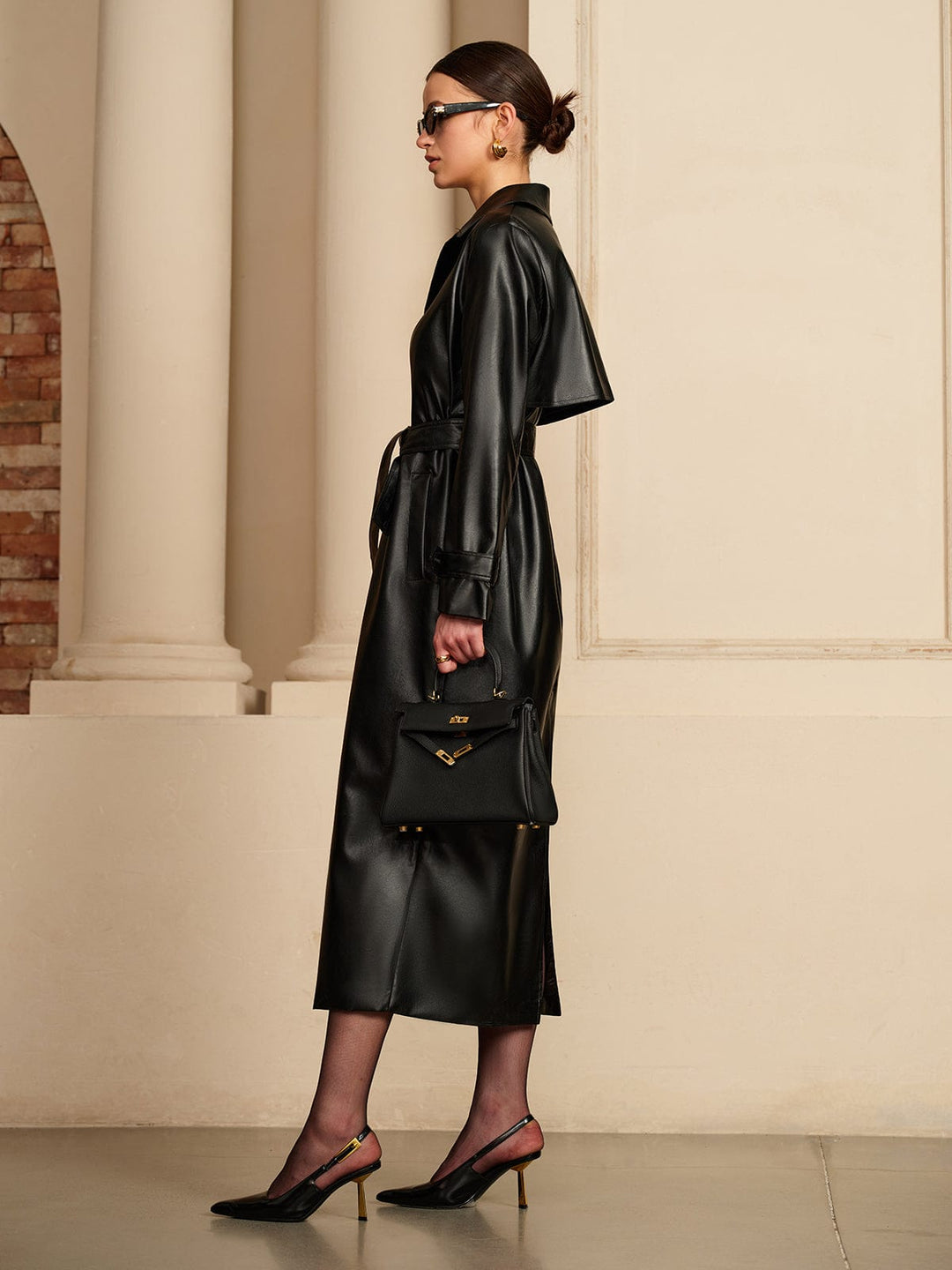 Fashionable women's outerwear: lightweight leather-look summer jacket with a stylish belt. Comfortable & chic.