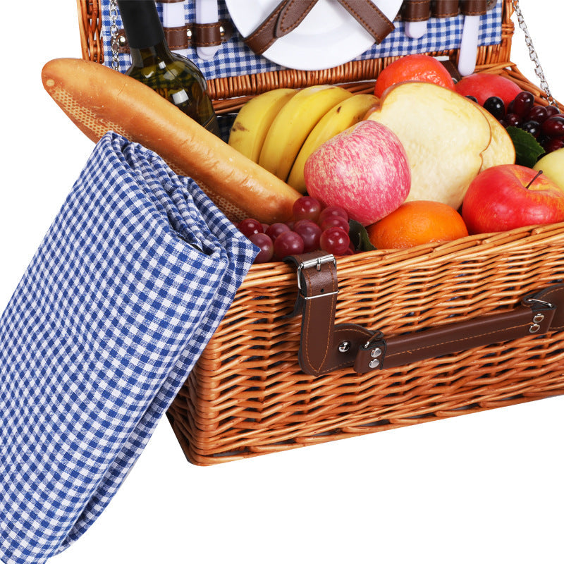 Elegant women's picnic basket featuring full crockery set & insulated cooler, perfect for gourmet meals.