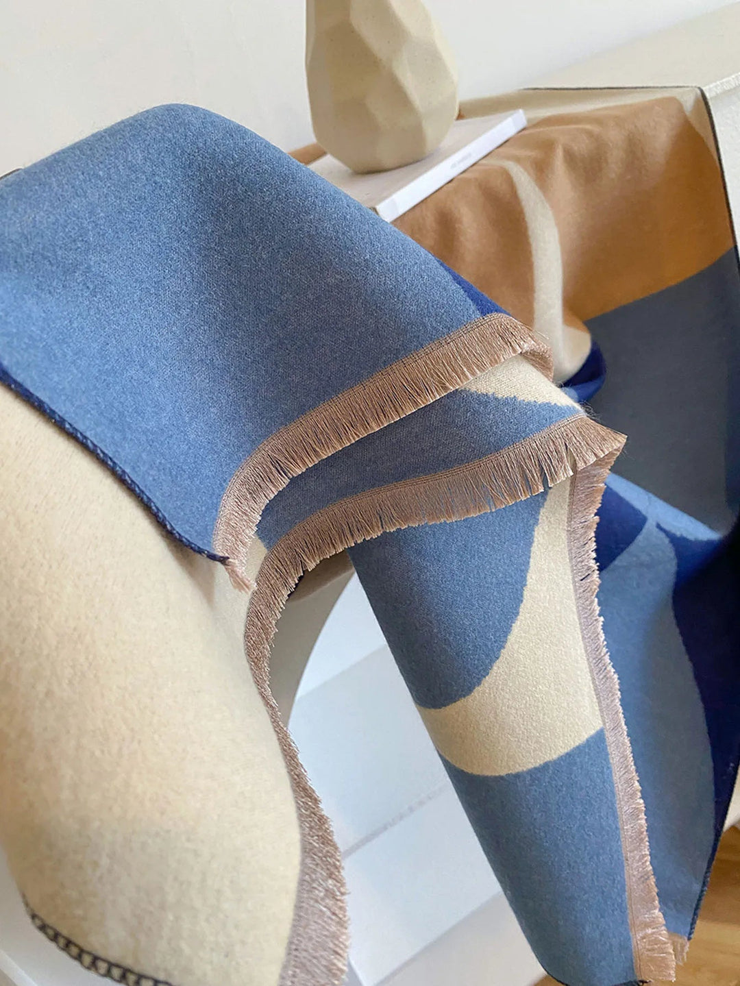 Experience luxury with this women's soft, warm, reversible lilac and black scarf.